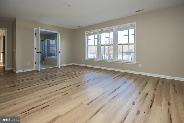 a bath tub sitting next to a white sink