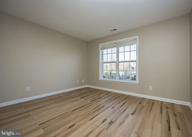 a view of balcony with wooden floor