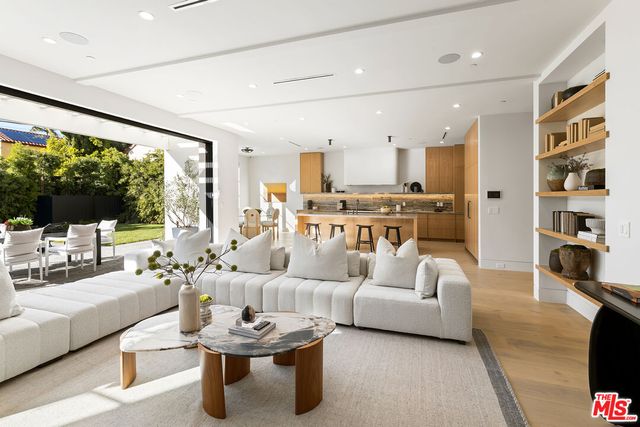 a large kitchen with kitchen island granite countertop a large counter top and dining table