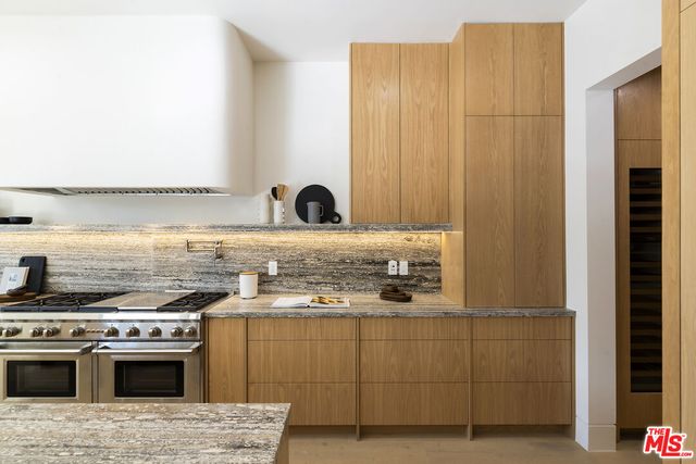 a kitchen with a stove and a sink