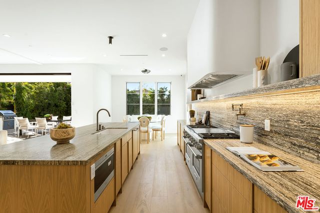 a bedroom with a bed and a night stand