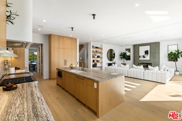 a bathroom with a sink toilet a mirror and shower