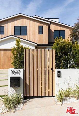 a view of a house with a door and a window