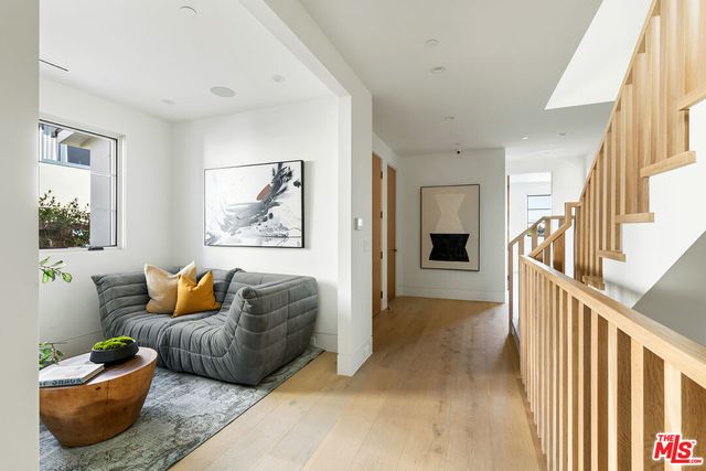 a spacious bathroom with a tub sink and mirror