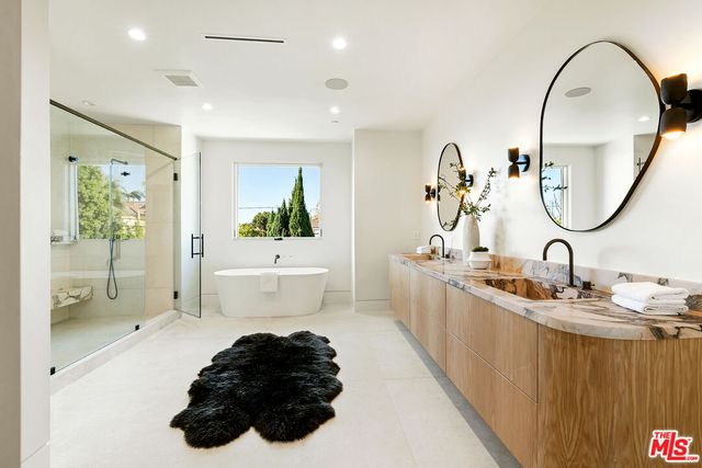 a bedroom with a bed and a chair