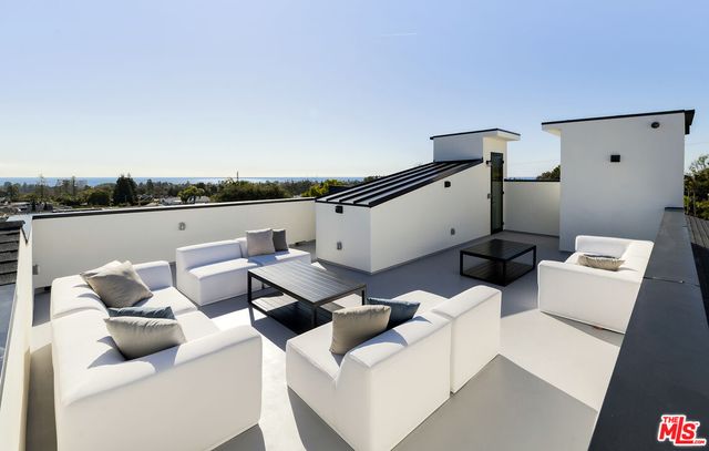 a bathroom with a sink toilet mirror and shower