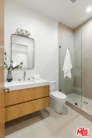 a living room with furniture and a night stand