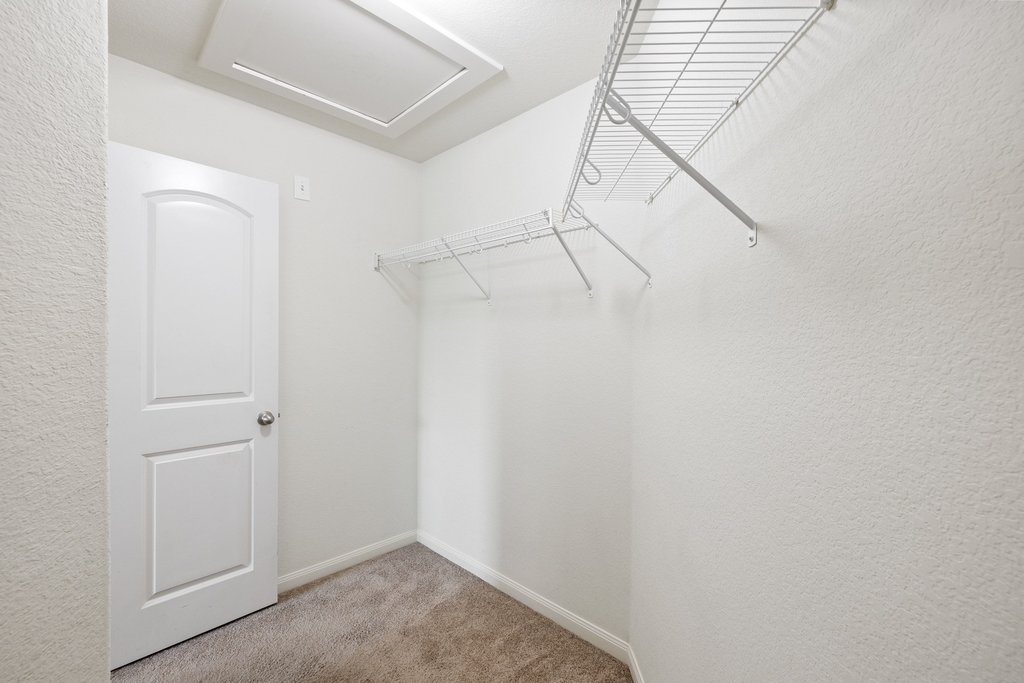 217 Farmer Lane Jarrell, TX 76537 - Photo 17 of 29 Ample closet space with wire shelving offers practical storage solutions.