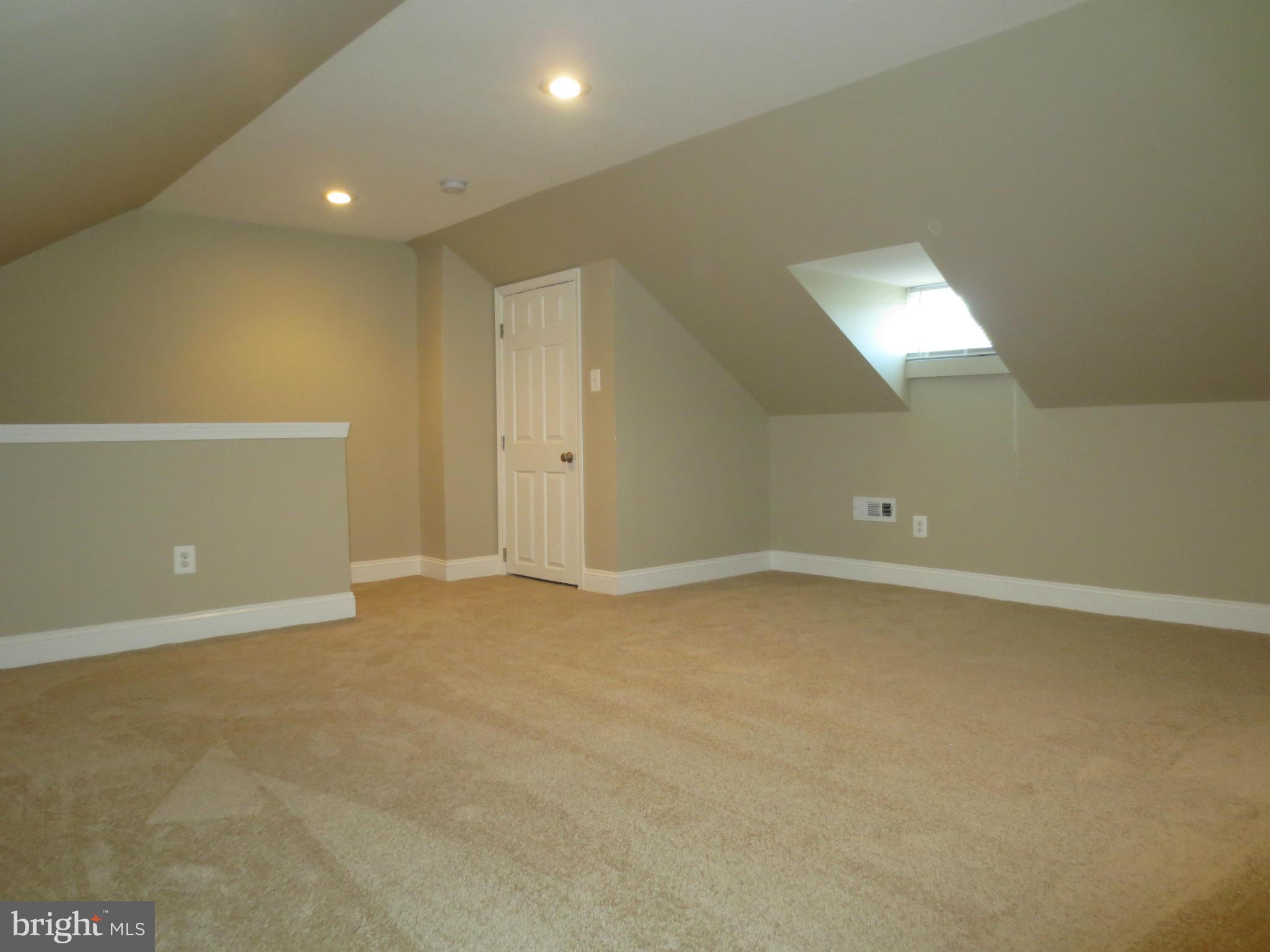 1704 Heathfield Road Baltimore, MD 21239 - Photo 16 of 28 Attic Loft Bedroom