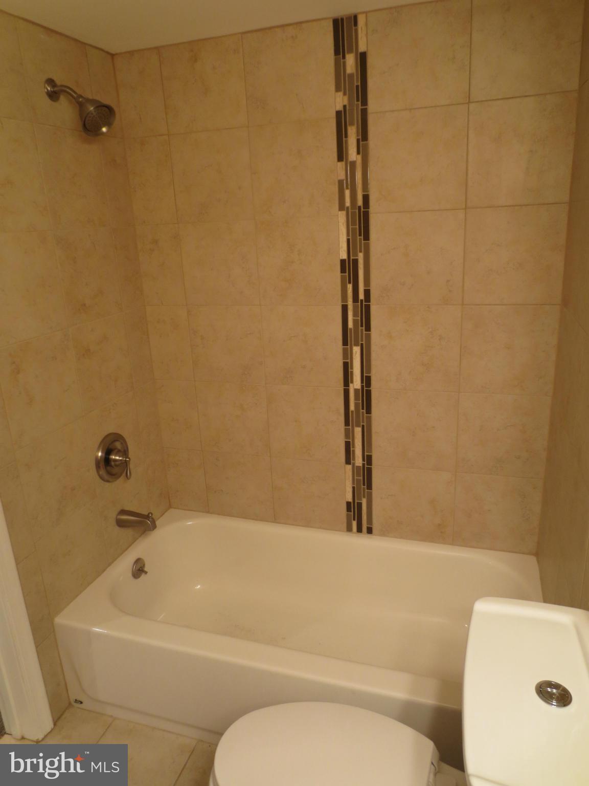 1704 Heathfield Road Baltimore, MD 21239 - Photo 23 of 28 Basement Bath Custom Tilework