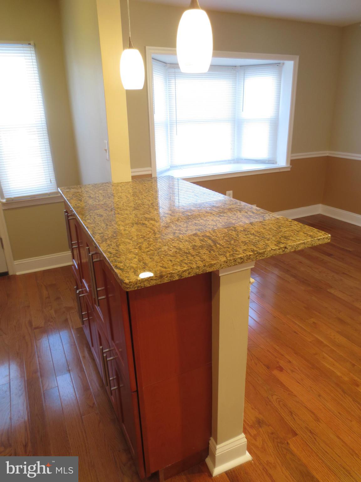 1704 Heathfield Road Baltimore, MD 21239 - Photo 4 of 28 Granite Breakfast bar, with cabinets