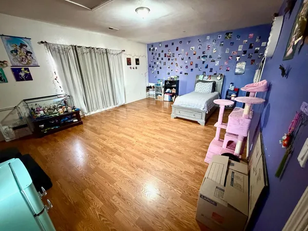 a bedroom with a bed and a shower