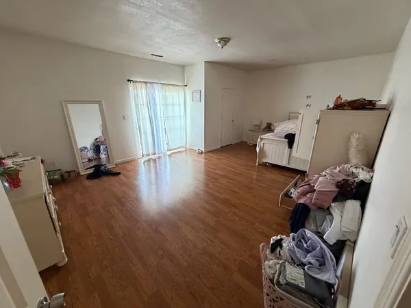 a view of a storage & utility room with wooden floor