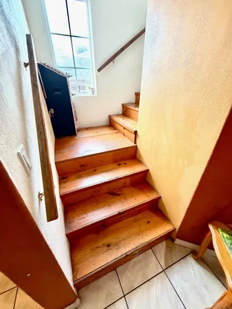 a view of a livingroom with wooden floor