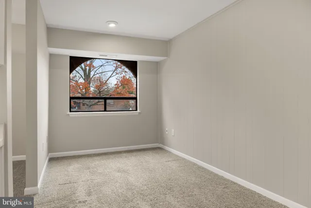 an empty room with wall painting and a painting on the wall