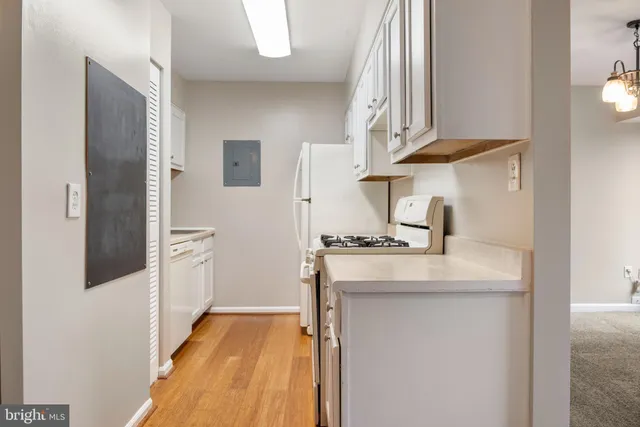 a kitchen with stainless steel appliances granite countertop a sink and a stove
