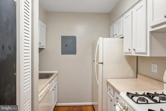 a kitchen with a refrigerator and a stove