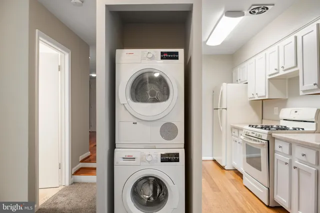 a view of a kitchen with washer and dryer