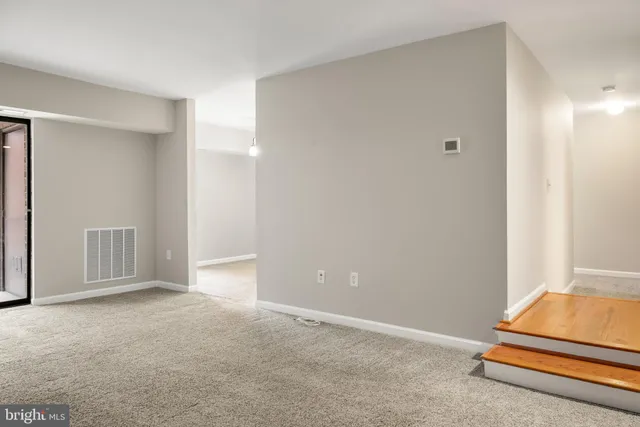 a view of room with air conditioner and window