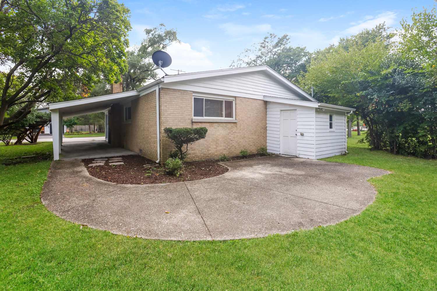 1462 Deerfield Road Deerfield, IL 60015 - Photo 14 of 14 a front view of a house with a yard and garage