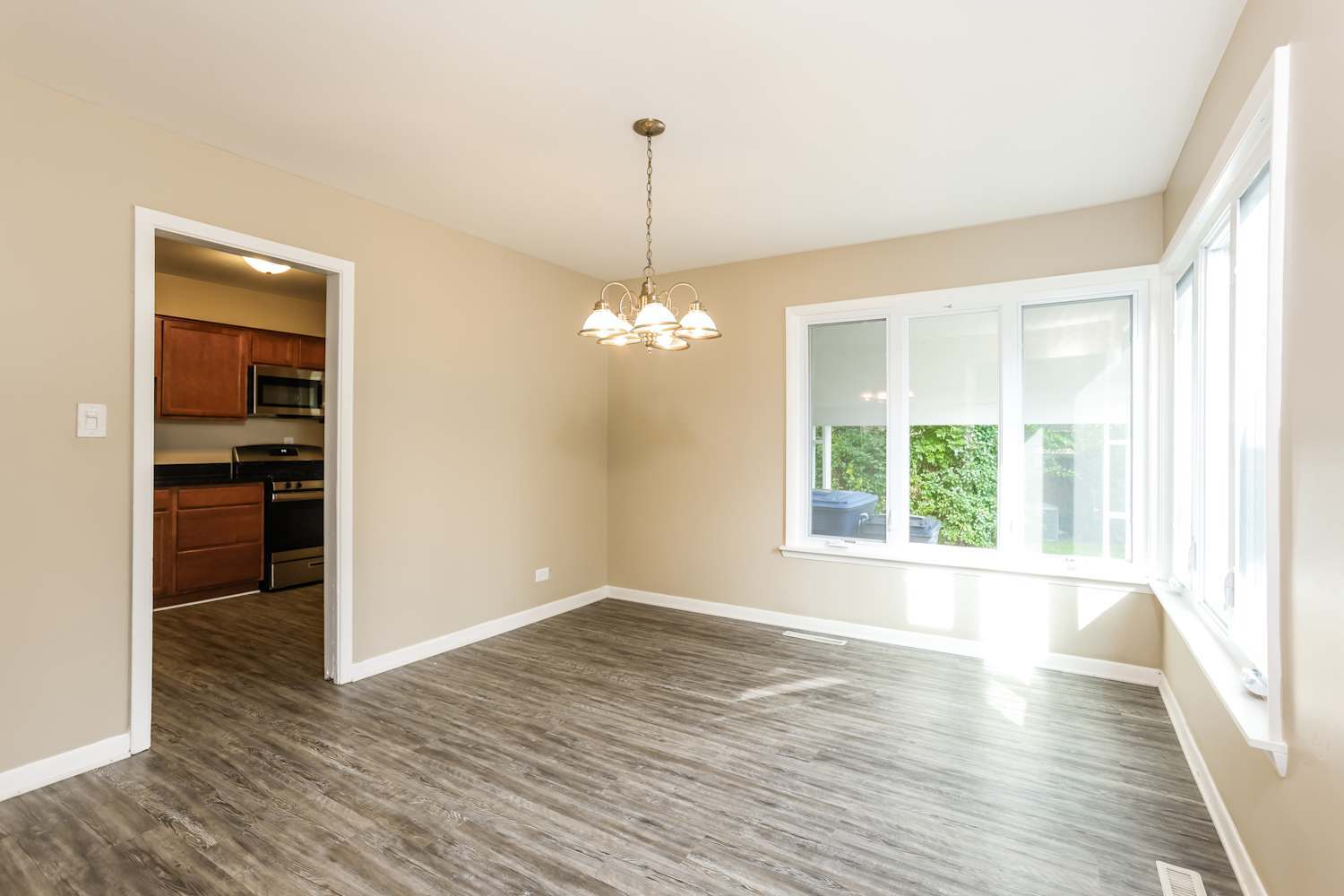 1462 Deerfield Road Deerfield, IL 60015 - Photo 3 of 14 a view of empty room with wooden floor and fan