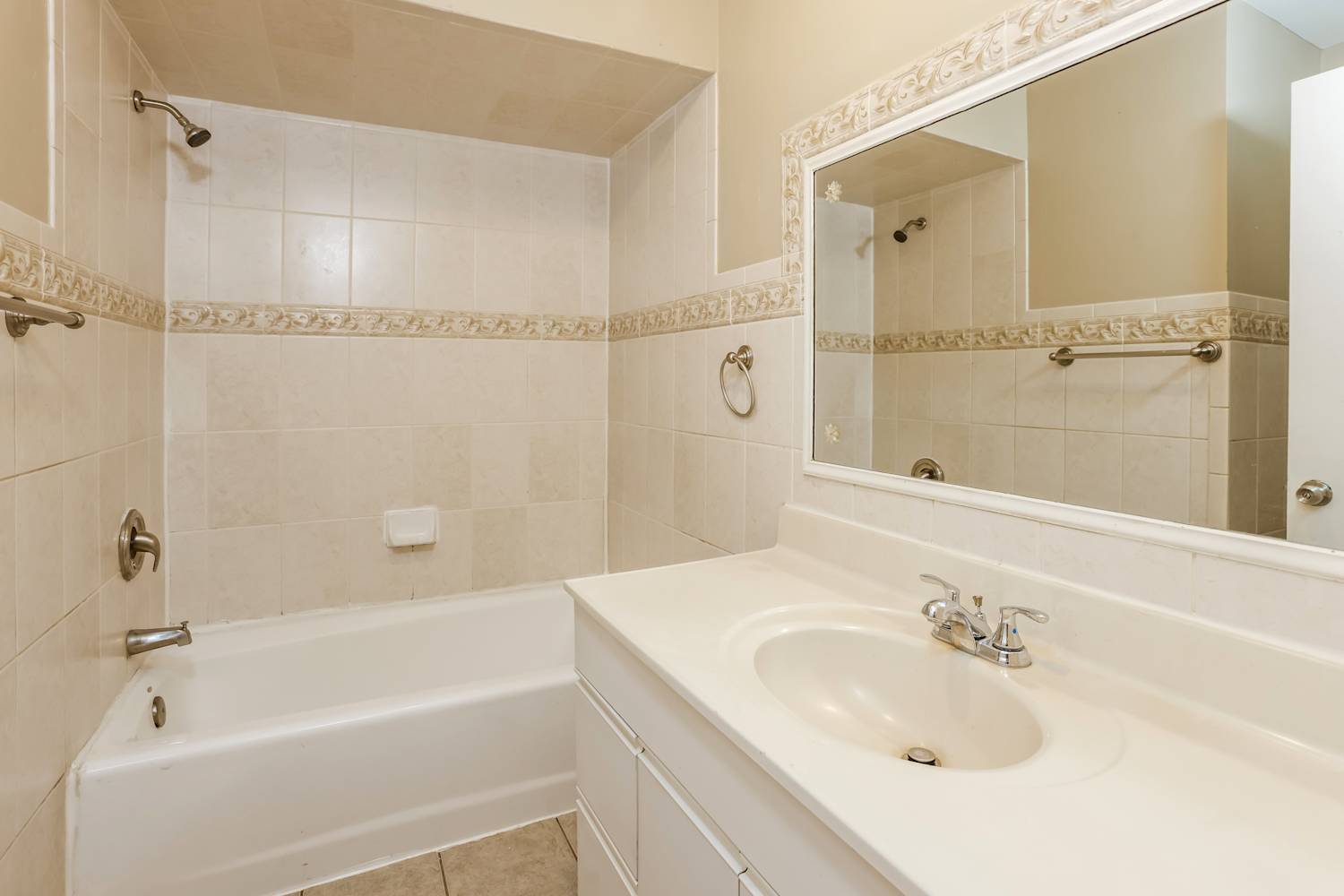 1462 Deerfield Road Deerfield, IL 60015 - Photo 6 of 14 a bathroom with a bathtub shower sink vanity and a mirror