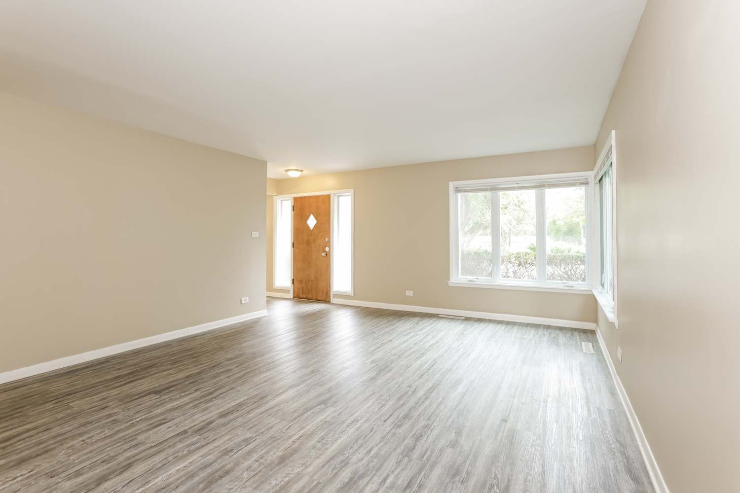 1462 Deerfield Road Deerfield, IL 60015 - Photo 10 of 14 an empty room with wooden floor and windows