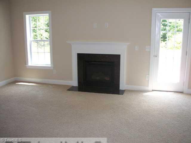 6311 Ridge Haven Road Greensboro, NC 27410 - Photo 3 of 12 Living Room. Living Room with fireplace and gas logs.