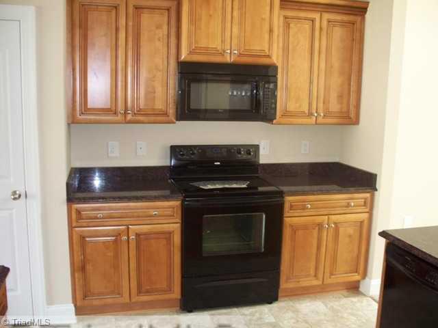 6311 Ridge Haven Road Greensboro, NC 27410 - Photo 6 of 12 Kitchen. Lots of cabinets.