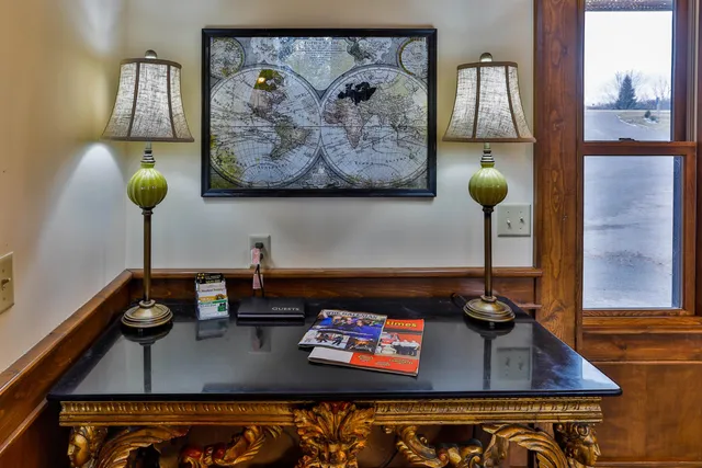 a view of a dining room with furniture and chandelier
