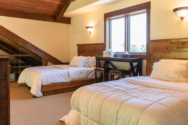 a view of a dining room with furniture and window