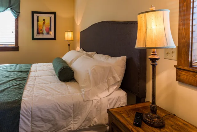 a dining room with furniture and a window
