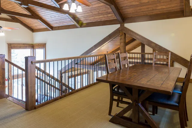 a wooden bench sitting in the middle of a yard