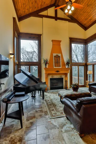 a living room with furniture a window and a fireplace