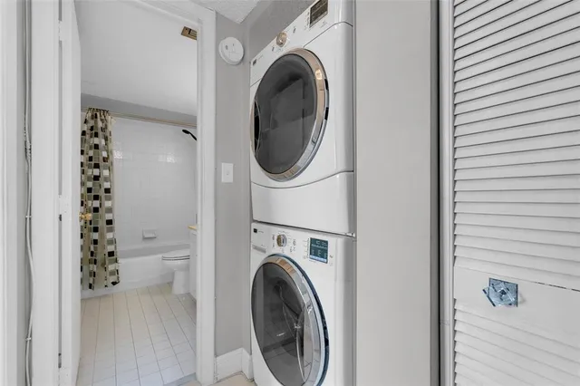 a view of a hallway with washer and dryer