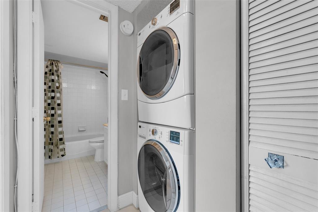 3940 Inverrary Boulevard, Unit 806A Fort Lauderdale, FL 33319 - Photo 11 of 36 a view of a hallway with washer and dryer