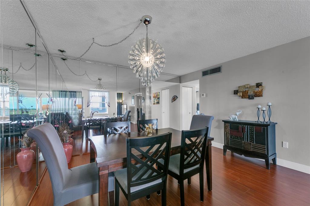 3940 Inverrary Boulevard, Unit 806A Fort Lauderdale, FL 33319 - Photo 14 of 36 a view of a dining room with furniture window and wooden floor