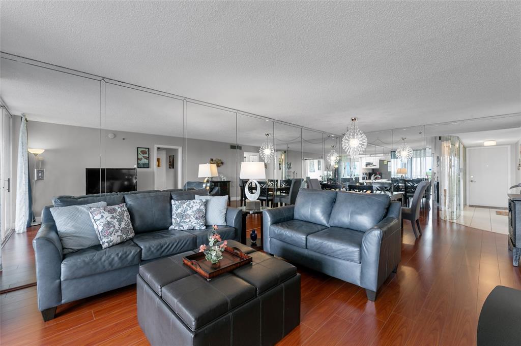 3940 Inverrary Boulevard, Unit 806A Fort Lauderdale, FL 33319 - Photo 16 of 36 a living room with furniture and a wooden floor