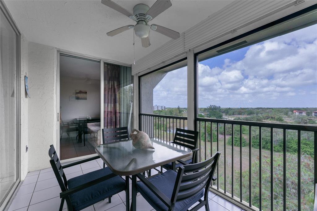 3940 Inverrary Boulevard, Unit 806A Fort Lauderdale, FL 33319 - Photo 3 of 36 a view of a balcony with a table and chairs