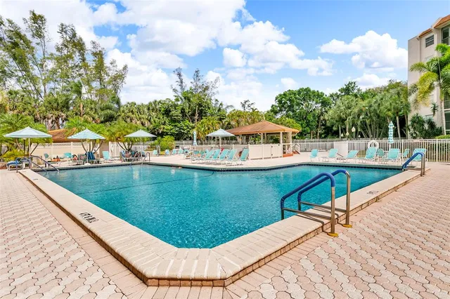a view of a swimming pool with a lake