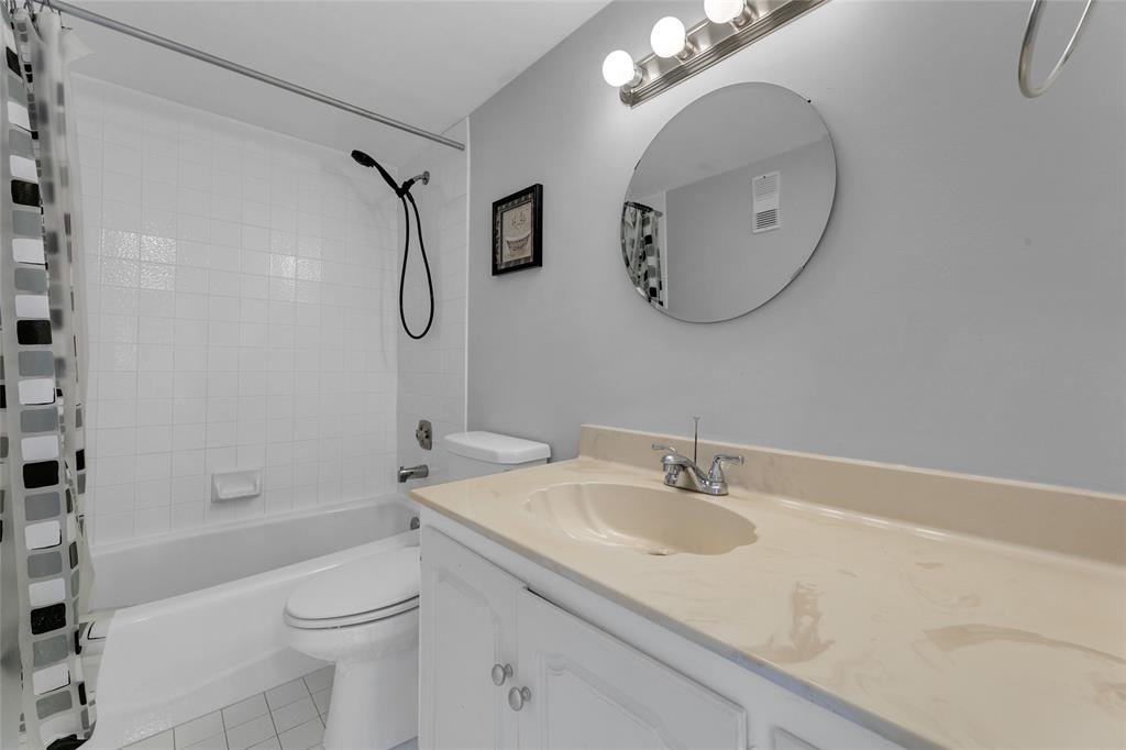 3940 Inverrary Boulevard, Unit 806A Fort Lauderdale, FL 33319 - Photo 10 of 36 a bathroom with a granite countertop sink a toilet and shower