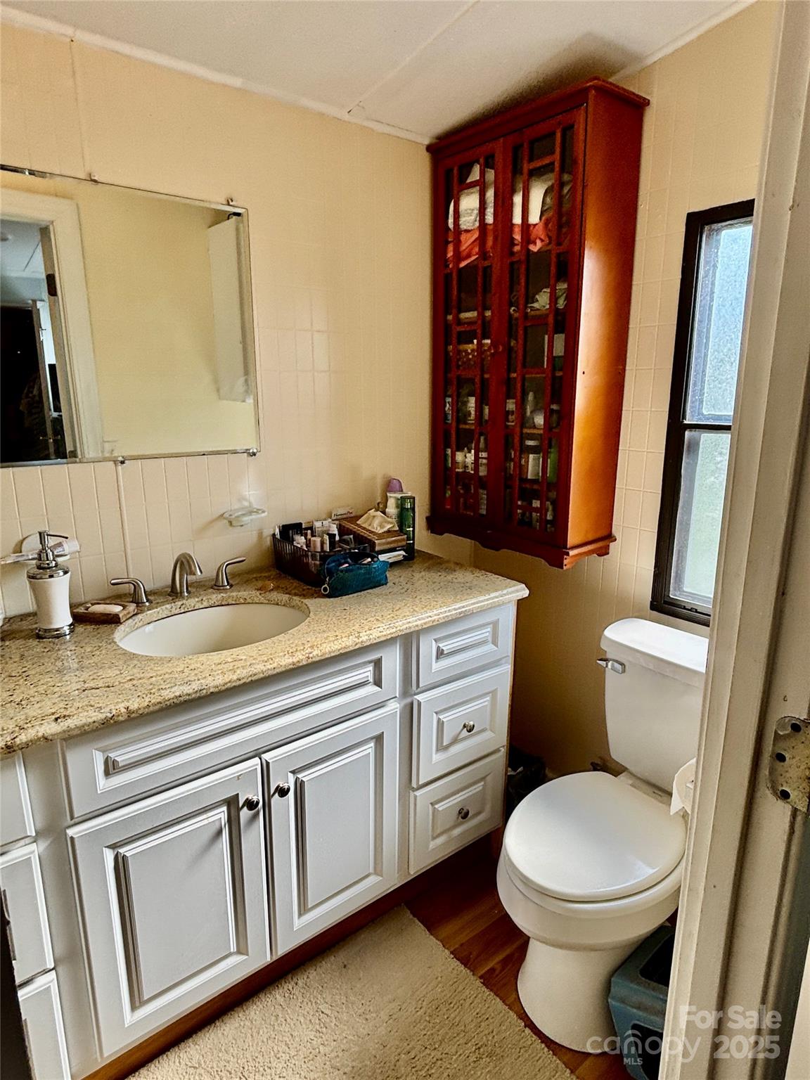 2830 Burgin Smith Road Vale, NC 28168 - Photo 16 of 38 a bathroom with a granite countertop toilet sink and mirror