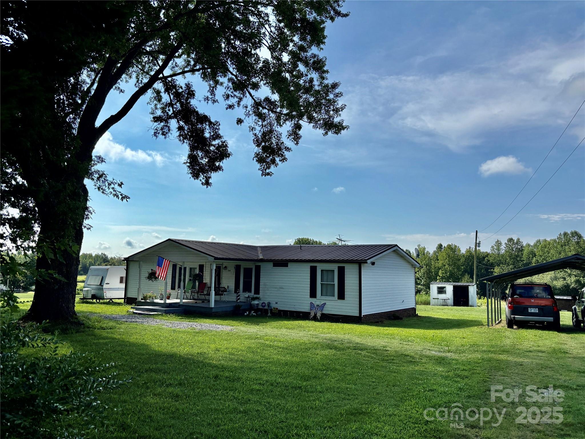 2830 Burgin Smith Road Vale, NC 28168 - Photo 2 of 38 a view of house with backyard
