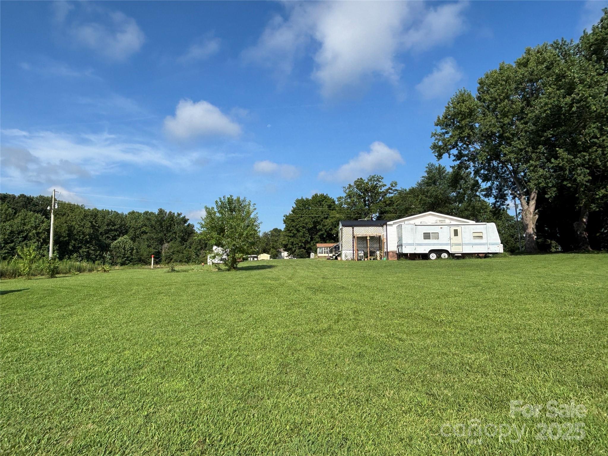 2830 Burgin Smith Road Vale, NC 28168 - Photo 25 of 38 a car parked in the middle of a field