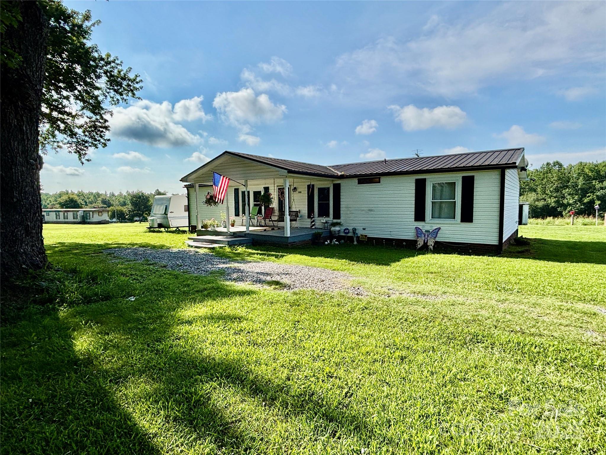 2830 Burgin Smith Road Vale, NC 28168 - Photo 26 of 38 a front view of house with yard and green space