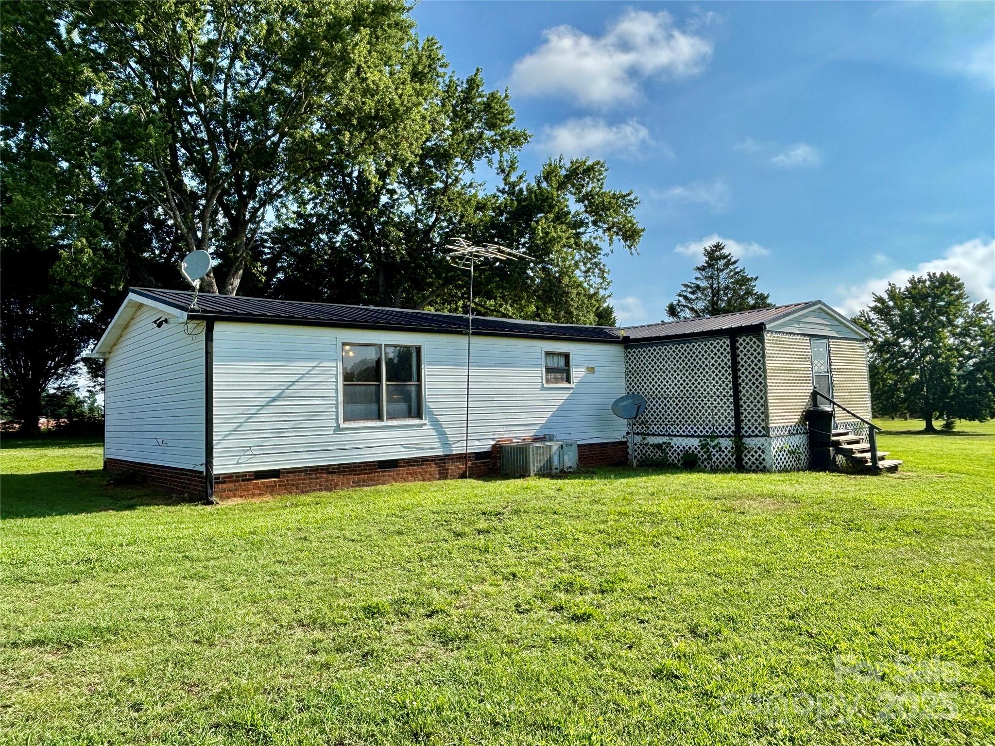 2830 Burgin Smith Road Vale, NC 28168 - Photo 27 of 38 a view of a house with a yard