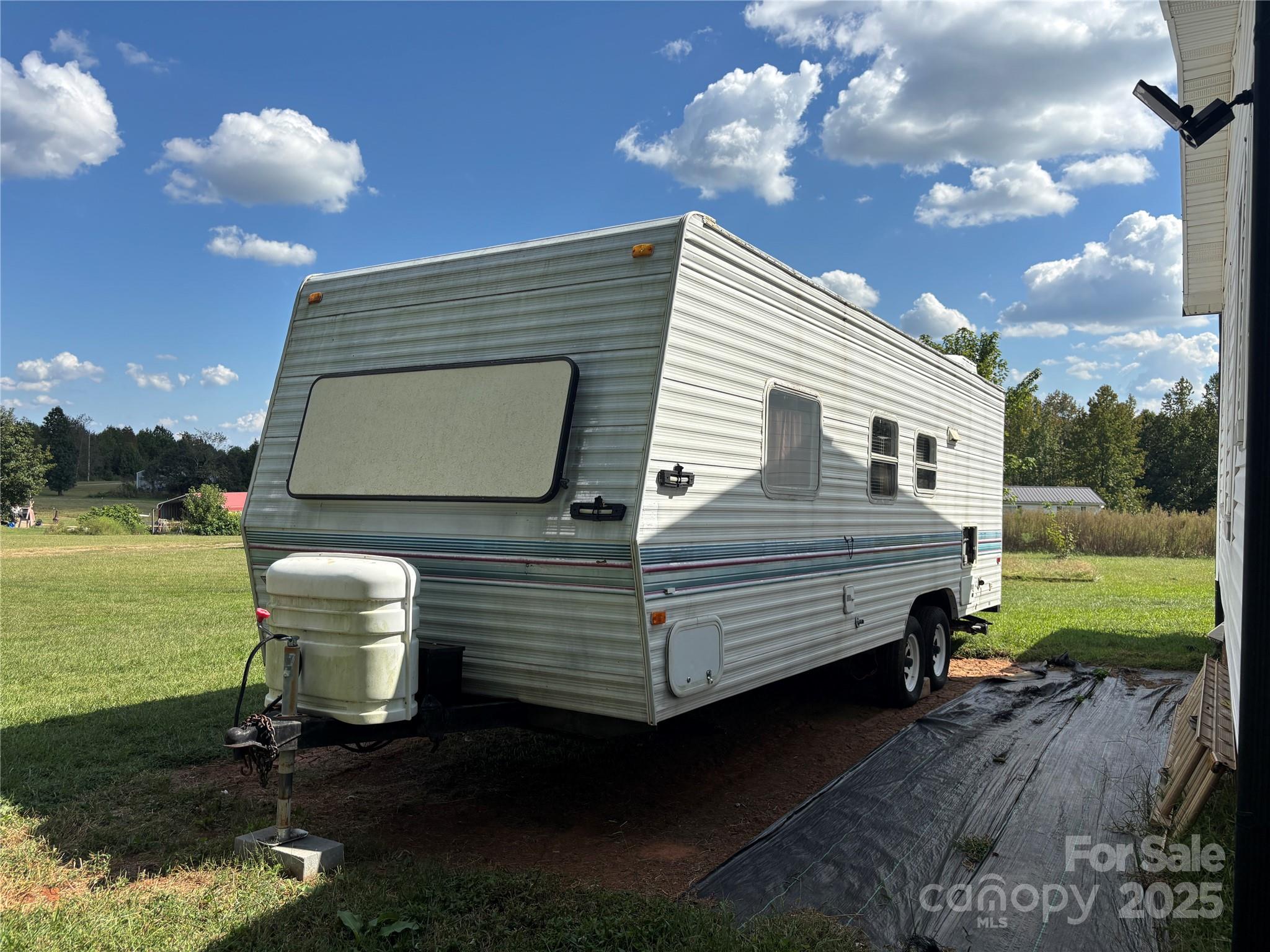 2830 Burgin Smith Road Vale, NC 28168 - Photo 33 of 38 a view of a two chairs in the patio next to a yard