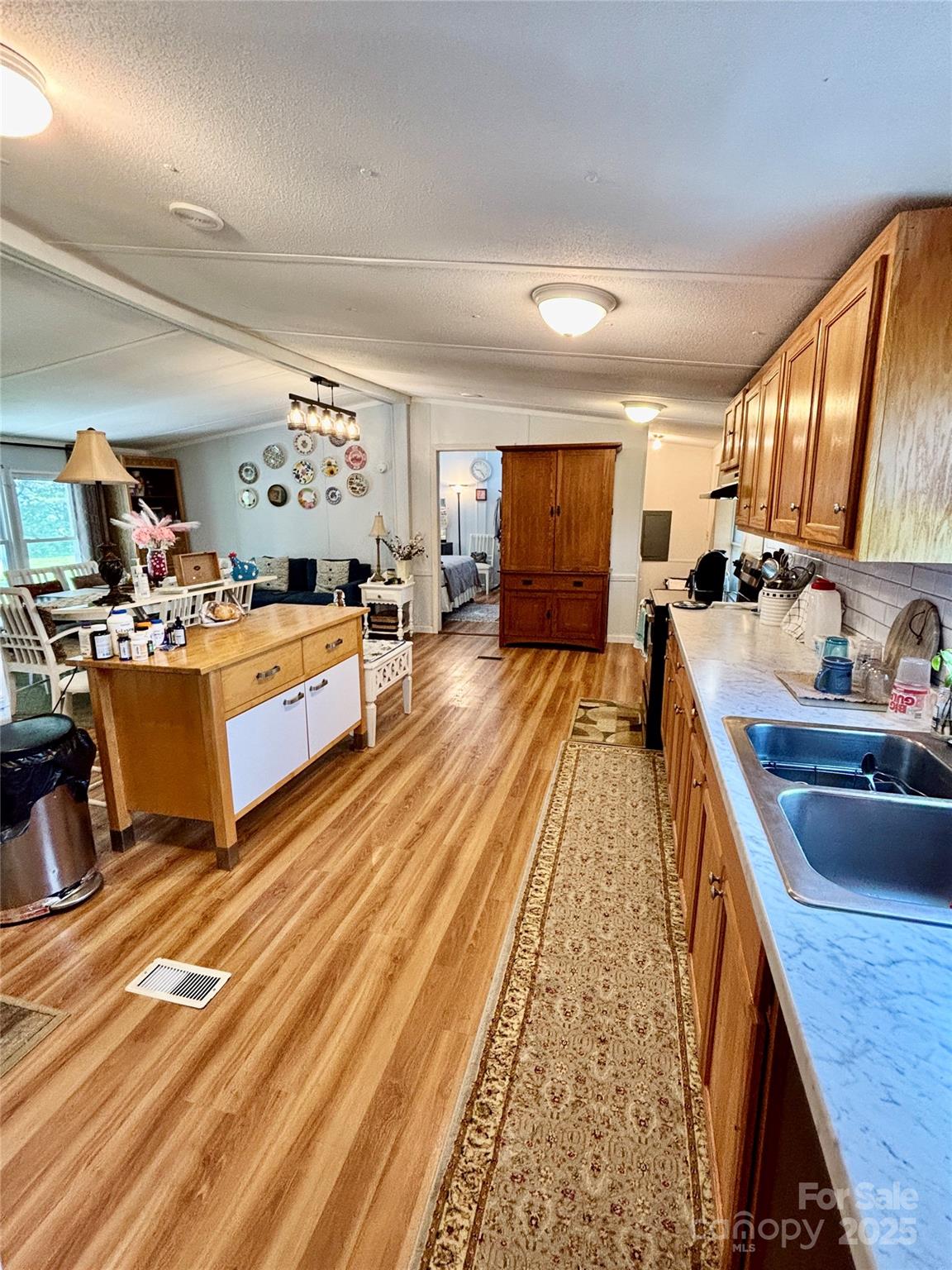 2830 Burgin Smith Road Vale, NC 28168 - Photo 6 of 38 a living room with furniture fireplace and a flat screen tv