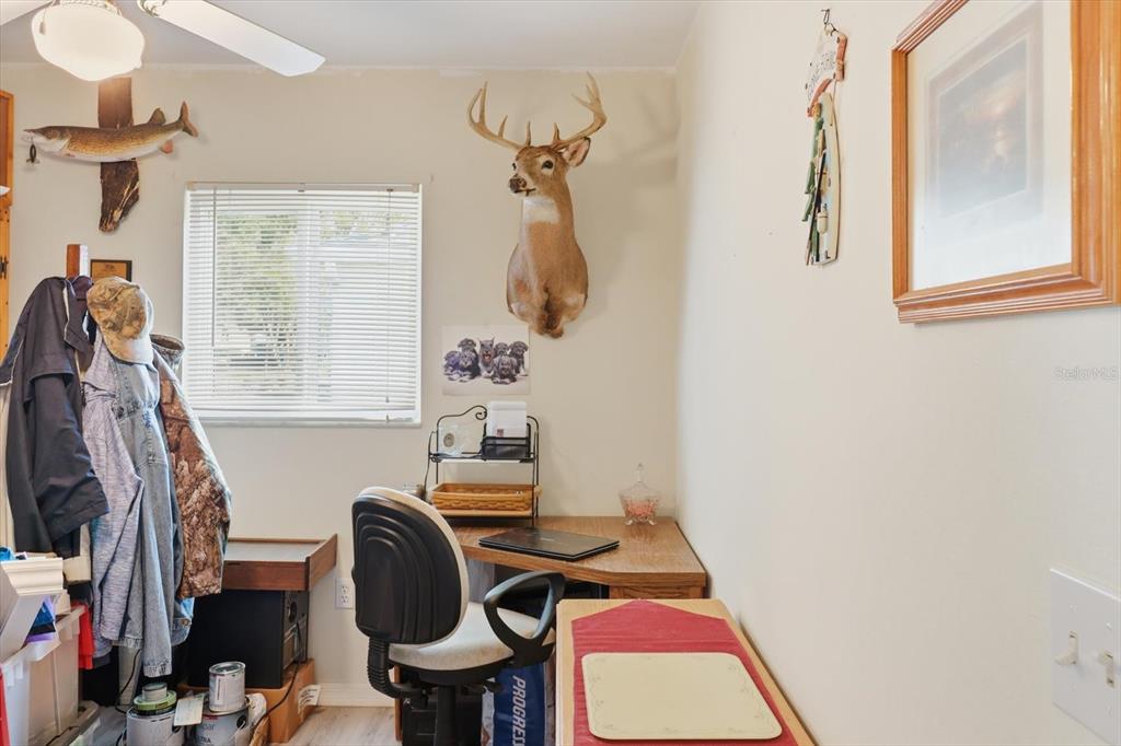 11263 Southwest 138th Lane Dunnellon, FL 34432 - Photo 12 of 53 a view of a workspace with furniture and a window