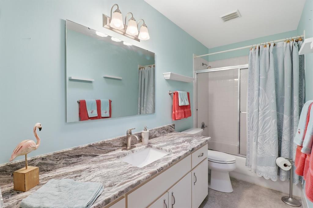 11263 Southwest 138th Lane Dunnellon, FL 34432 - Photo 20 of 53 a bathroom with a granite countertop sink and a mirror